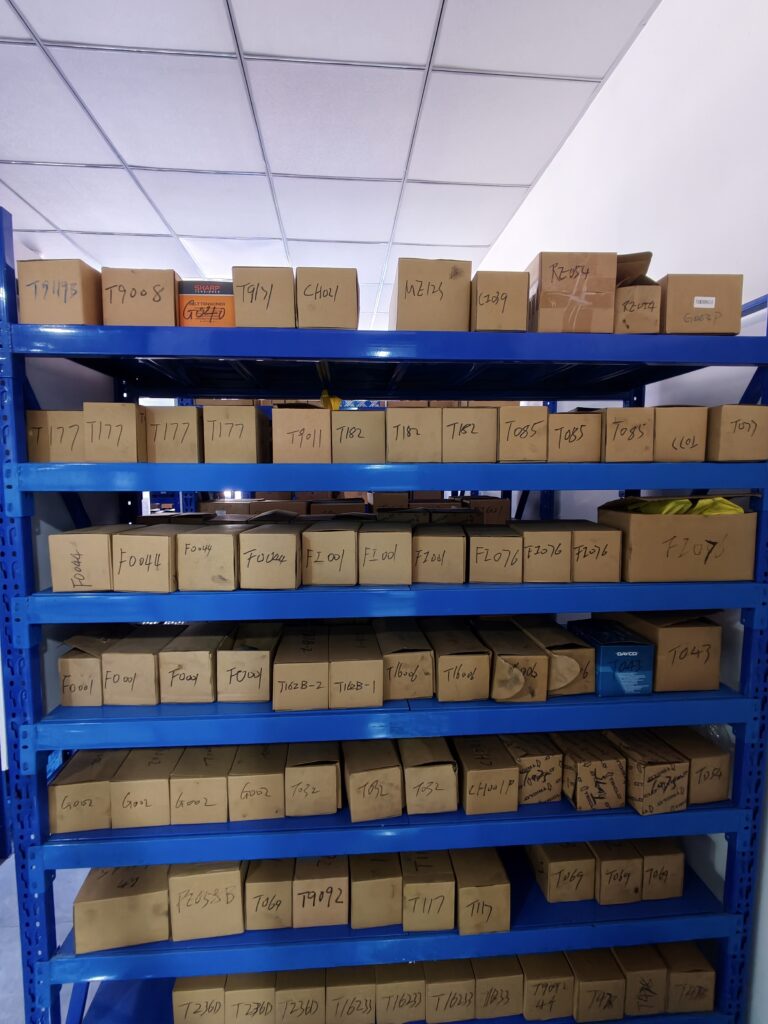 Boxed spare parts arranged on warehouse shelves